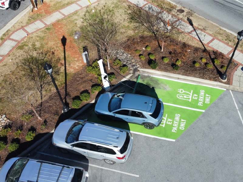 Overhead view of two EV charging parking spots